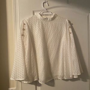 White poncho blouse with pearl details
